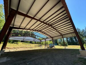 Interior view of 80x72 steel frame riding arena built by Zepp Construction in Elma WA